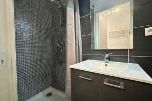 a bathroom with a sink and a shower at Bright and quiet studio in Nice in Nice +5 photos