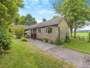 a stone house with a pathway leading to it at Steep Holm in Kington