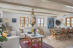 a living room with a couch and a table at SJ214-Fredericia-Lillenaes-71 in Fredericia