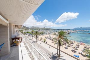 a view of a beach from a building at Port de Pollenca Esmeralda 3 in Port de Pollensa