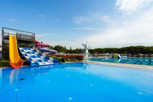 a large swimming pool with a water slide at Club del Sole Marina Julia Family Collection in Marina Julia