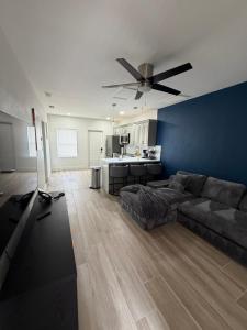 a living room with a couch and a ceiling fan at The Tel Ft Lauderdale in Fort Lauderdale +15 photos