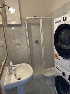 a bathroom with a shower and a sink and a toilet at Casa FERRIGNO in Portoferraio