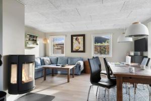 a living room with a couch and a fireplace at SJ277-Haderslev-Kelstrup-Norreskov-36 in Haderslev