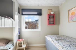 a bedroom with a bed and a window at SJ277-Haderslev-Kelstrup-Norreskov-36 in Haderslev