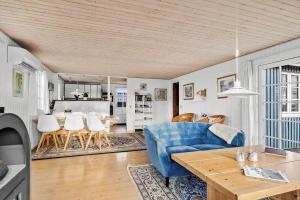 a living room with a blue couch and a table at SJ243-Haderslev-Vikaerparken-79 in Haderslev