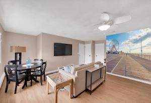 a living room with a couch and a dining room with a table at Between Tides 2BR Walk to Beach Unit C in Seaside Park