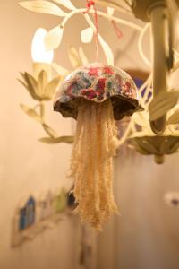 an old umbrella hanging from a ceiling at EMERALD Villa in Kithnos