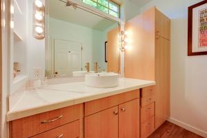 a bathroom with a sink and a mirror at Waterfront Bellingham Bliss: Steps to Beach! in Bellingham +24 photos