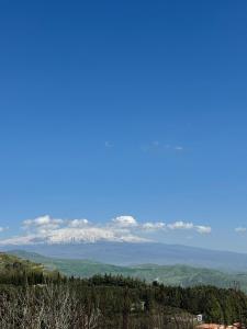 a view of snow covered mountains in the distance at Troina rooms in Troina
