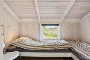 a bed in a room with a window at LN1789-Hjorring-Indemarken-44 in Hjørring
