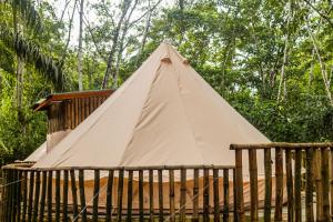 a teepee inside of a wooden fence at Barreo Nova Eco Resort in Abrafo +32 photos