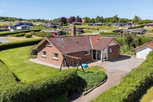 an aerial view of a house with a playground at SJ296-Hejls-Ae-Skovbryn-37 in Hejls