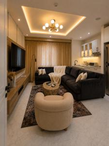 a large living room with a couch and a table at D'Empire in Lekki