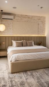 a bedroom with a large bed in a room at D'Empire in Lekki +16 photos