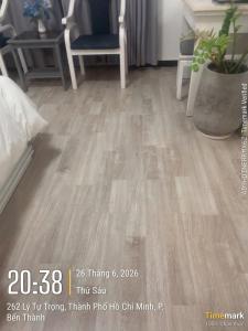 a picture of a room with a wooden floor at Financeer Hotel in Ho Chi Minh City