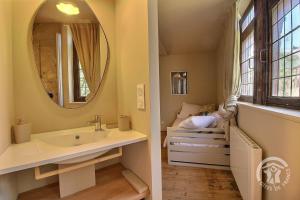 a bathroom with a sink and a mirror at Hôtel des ducs de bretagne in Saint-Brieuc +28 photos