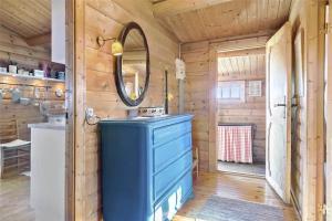 a bathroom with a blue sink and a mirror at LN1500-Hirtshals-Kranken-11 in Hirtshals