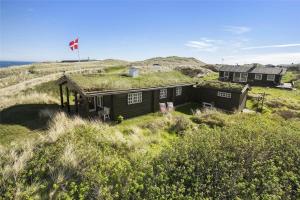 a house with a grass roof on top of a hill at LN1500-Hirtshals-Kranken-11 in Hirtshals