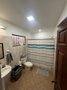 a bathroom with a toilet and a tub and a sink at Tropical Stay in Coco in Coco +12 photos