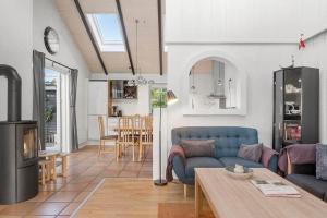 a living room with a couch and a table at SJ311-Hejls-Slaenvaenget-9 in Hejls