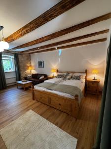 a bedroom with a large bed in a room at Ferienwohnung Strohblume 2 in Rust