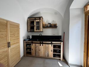 a kitchen with a counter and a sink in a room at Ferienwohnung Strohblume 2 in Rust +33 photos