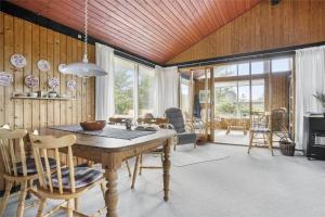 a dining room with a table and chairs at LN76740-Hjorring-Sostjernevej-11 in Hjørring