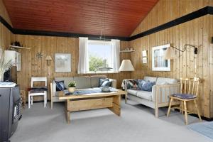 a living room with a couch and a table at LN76740-Hjorring-Sostjernevej-11 in Hjørring