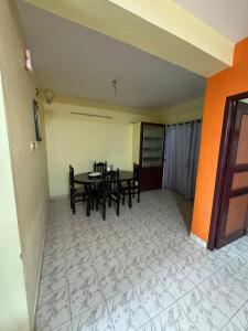 a dining room with a table and chairs at DD cottages in Ooty