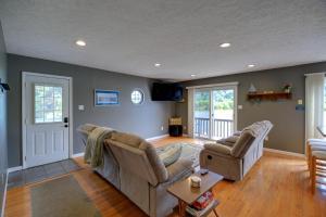 a living room with two couches and a table at Fire Pit & Floating Dock! Claytor Lake Hideout in Draper