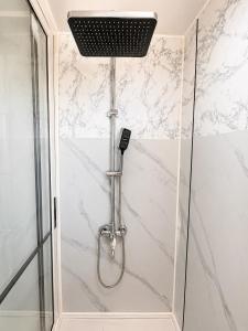 a shower with a shower head in a bathroom at Oceanfront Villa, Punta Mango in Jucuarán