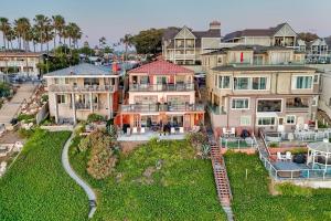an aerial view of a large house with a yard at Oceanfront unit, Private Balcony, Beach Access, Sunset Views in Carlsbad
