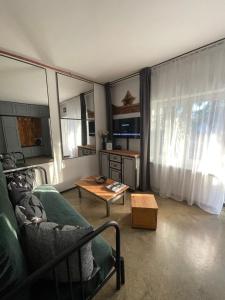 a living room with a couch and a coffee table at Villa Karabelli in Búč