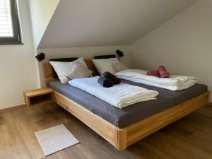 two beds with pillows on them in a room at Apartment Turmfalke in Vogtsburg
