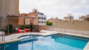 a swimming pool on the roof of a building at Altezza Apart Suites in Mendoza
