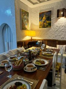 a table with plates of food on it at Dar Yessine Boutique Hôtel in Sousse