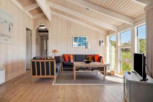 a living room with a couch and a table at LN674-Hjorring-Rodspaettevej-16 in Hjørring