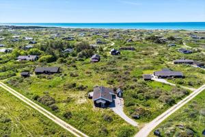 an aerial view of a house with the ocean at LN674-Hjorring-Rodspaettevej-16 in Hjørring