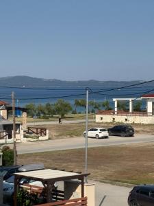 a view of a street with cars parked in a parking lot at Azure & Zest Suites in Ierissos
