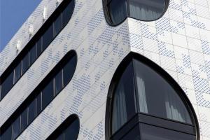a building with a lot of windows on it at COVE Centrum in The Hague