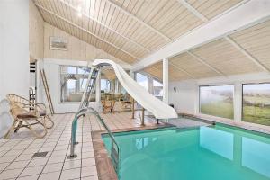 a swimming pool with a slide in a house at LN1791-Hjorring-Hongardsvej-1 in Hjørring