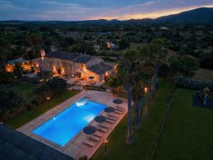 an aerial view of a house with a swimming pool at Finca Hotel Ses Cases Noves in Sant Llorenç des Cardassar