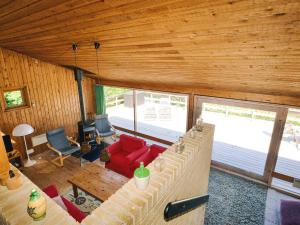 an overhead view of a living room with a red couch at 8 person holiday home in Asnæs in Asnæs
