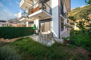 a table and chairs in front of a building at My house in Kaş in Kaş
