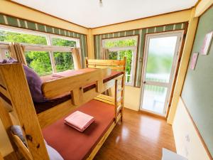 a room with bunk beds in a tiny house at 3 Mins Drive to Marlboro Hills - Sagada Dad's Homestay in Sagada