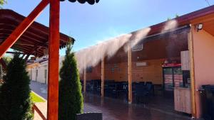 a building with smoke coming out of it at Casa SOL in Turda