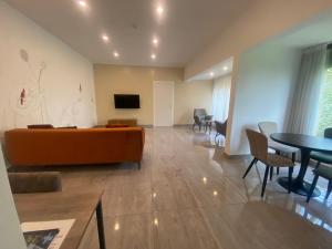 a living room with a couch and a table at Casa Bianca in Accra +6 photos