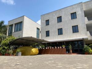 a building with a tent in front of it at Casa Bianca in Accra