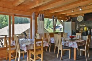 a dining room with a table and chairs at Chalet Le Plan du Rtia in Morzine